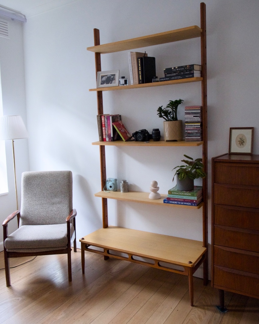 Armchair next to bookshelf